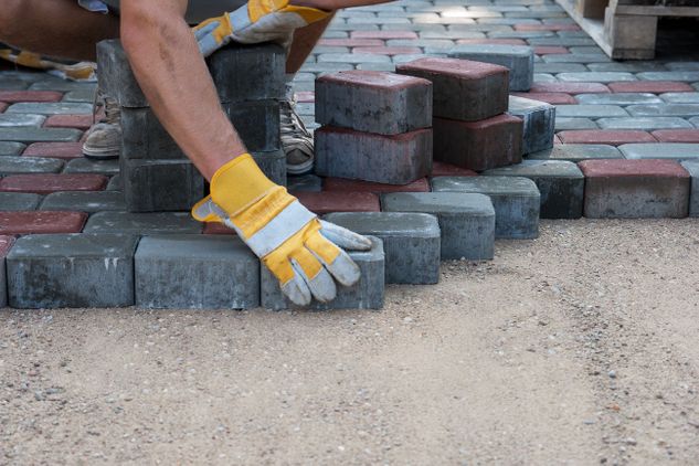 A member of our team laying block paving